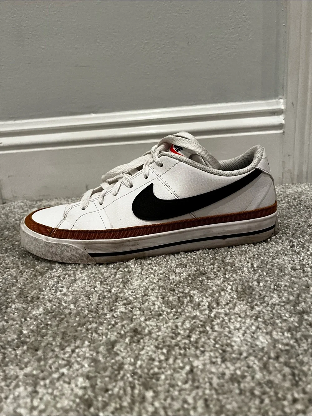 Nike women’s White Sneakers with Black Swoosh and Brown Trim